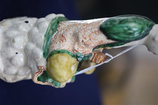 A Chinese Sancai glazed pottery seated figure of Guanyin, Qing dynasty, H.27cm, some flaking to glaze